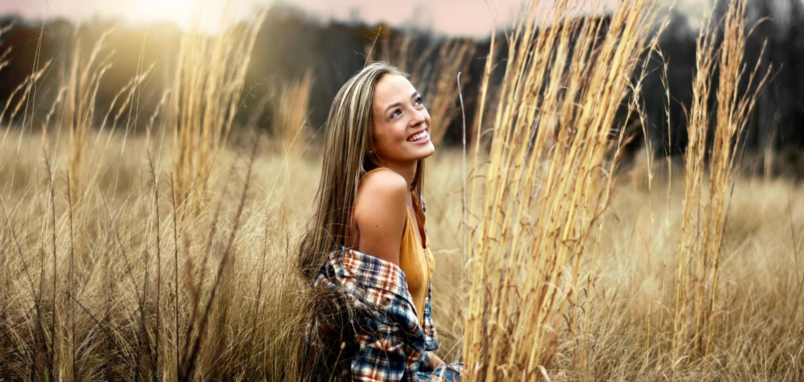 Bree smiling in a field