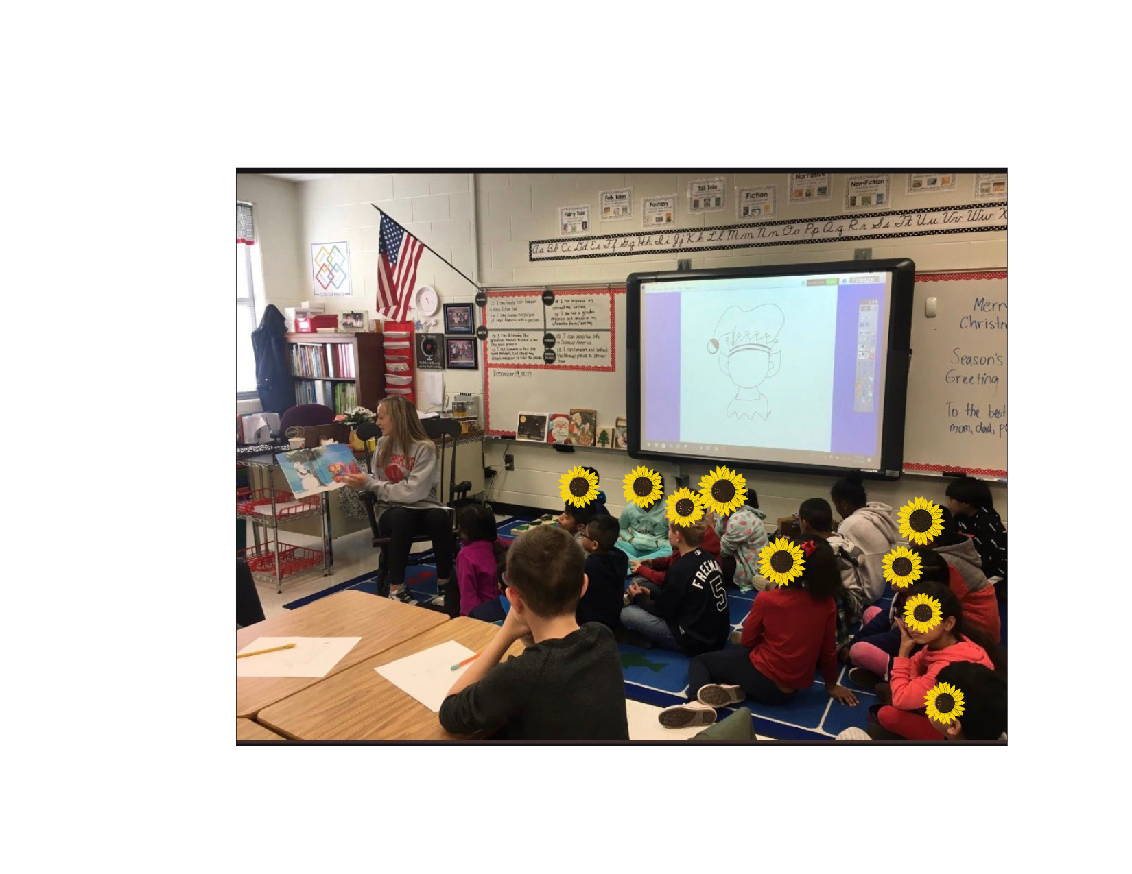 Bree reading to a classroom full of children